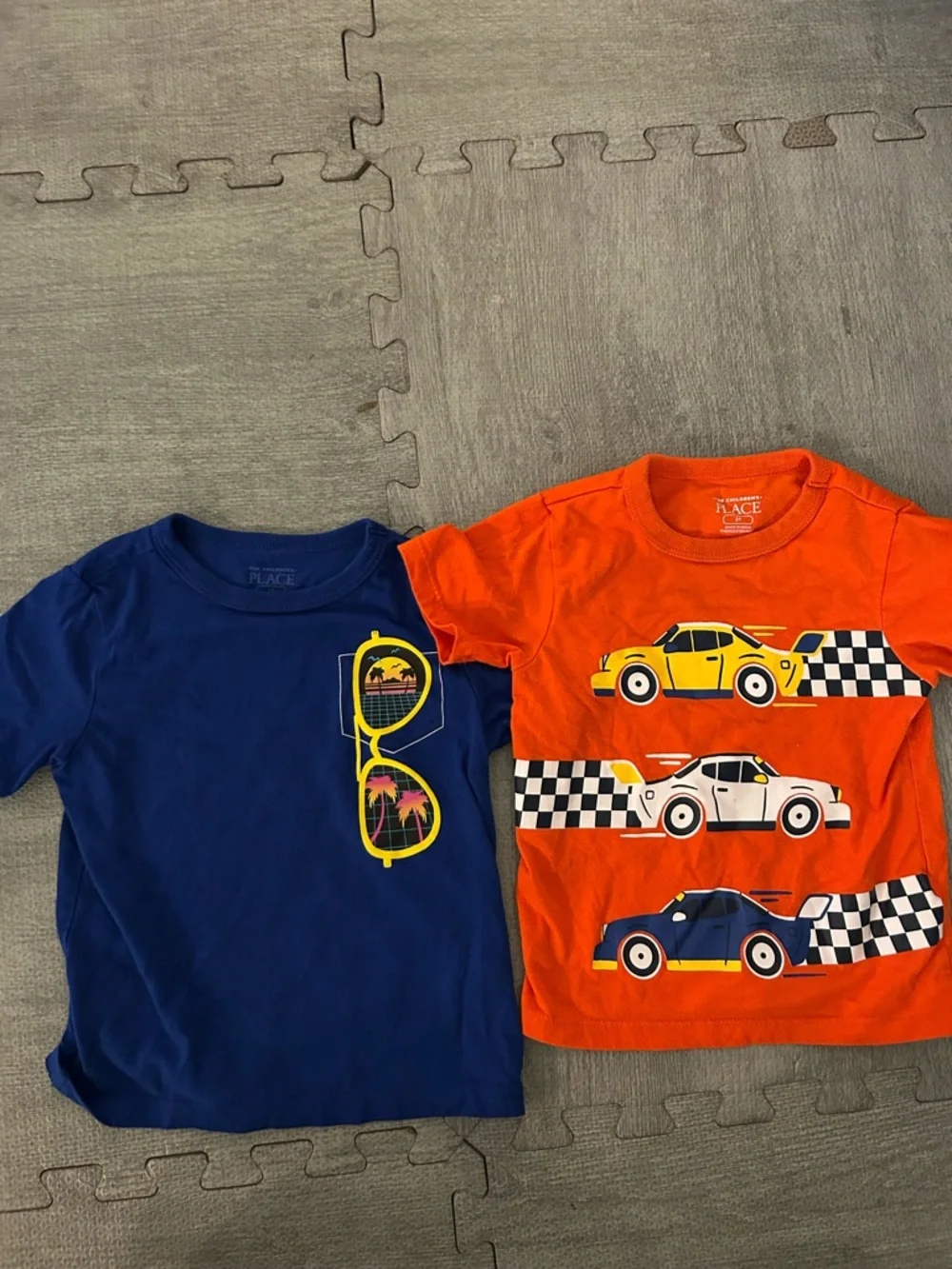 The Children's Place Orange and Blue Graphic Tee Set. (2 shirts)